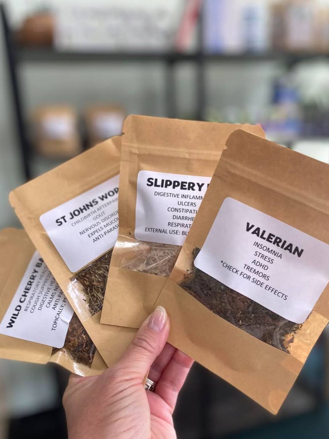 Loose herbs in kraft pouches on the herb shelf