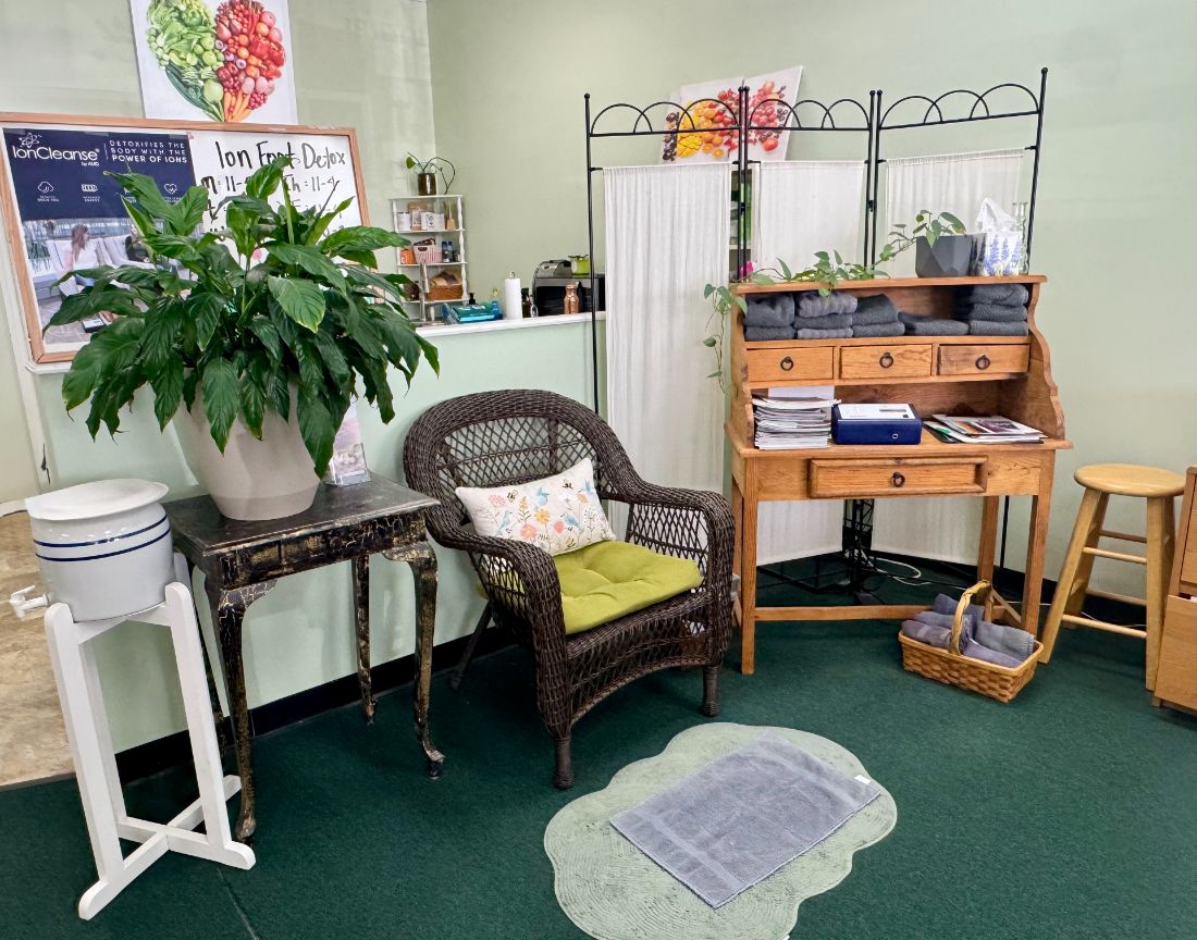 The ion foot detox corner with a wicker chair and warm towels