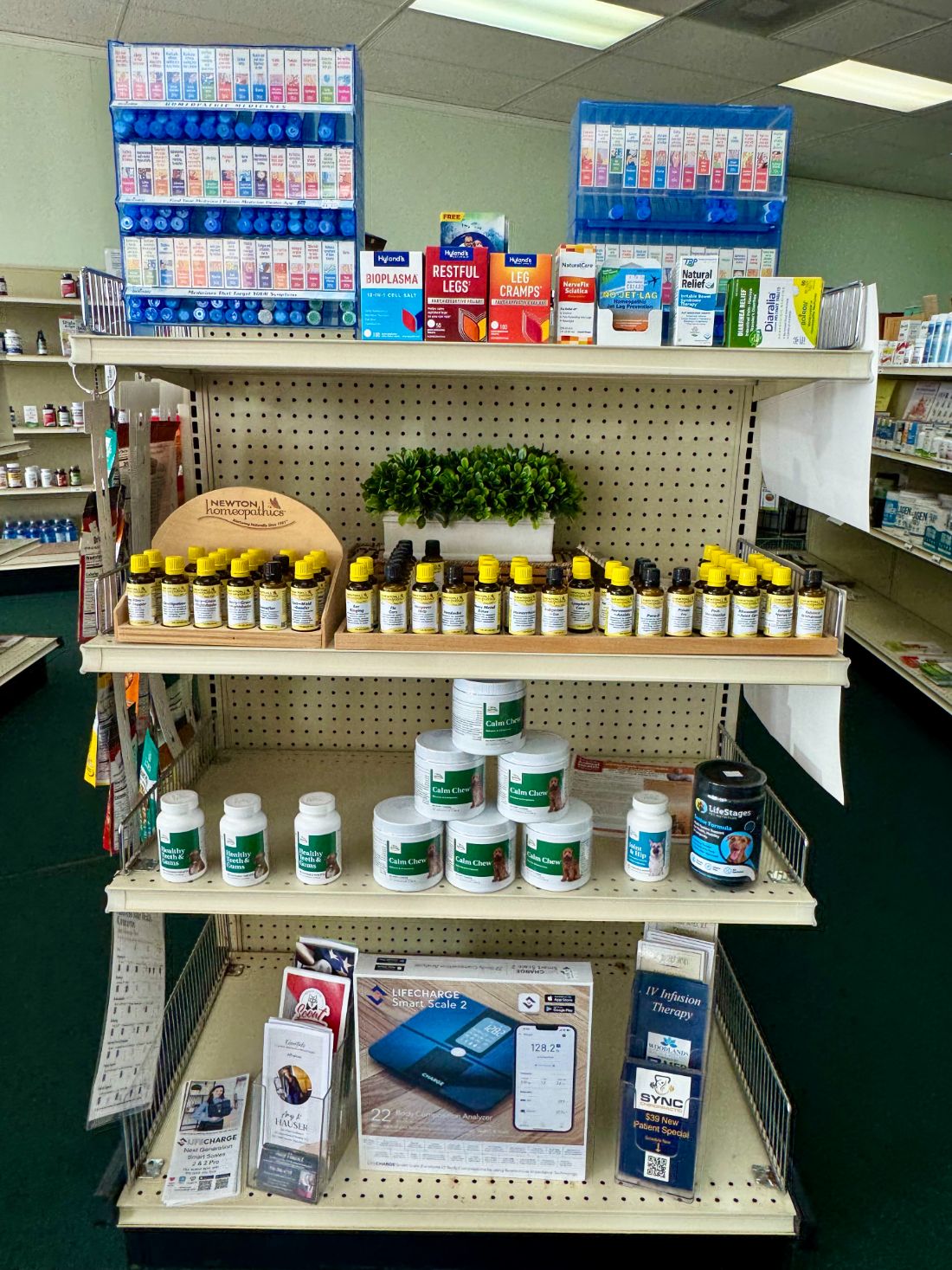The homeopathy shelf with Boiron racks and NEWTON single remedies